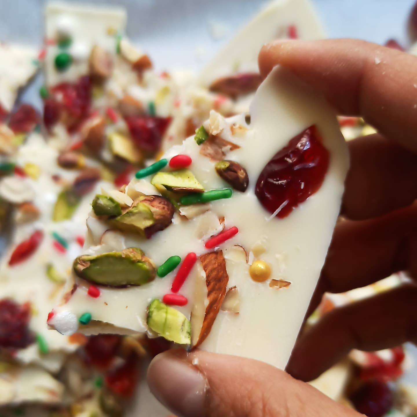 Two Ingredient Christmas Bark: It really doesn't get easier than this. This chocolate bark is Christmassy in every way. 

You'll need 
300 gms, white chocolate, melted
1 cup chopped dry fruits ( I've used pistachios, almonds, cranberries, walnuts and a dash of sprinkles. 

To make the chocolate bark, pour the melted chocolate over a tray lined with baking paper. Spread into a thin layer using a spatula. Sprinkle the chopped dry fruits all over. Leave to set in the fridge. Break into smaller pieces, once set. 

Follow@bakingwithrona for more festive treats. 

www.bakingwithrona.com

#bakingwithrona #christmasiscoming
#christmasgoodies #christmastreats #easytreats #easychristmas #easysweets #2ingredients #mostwonderfultimeoftheyear #favouritetimeofyear #foodvideos #howto #sweets #treats