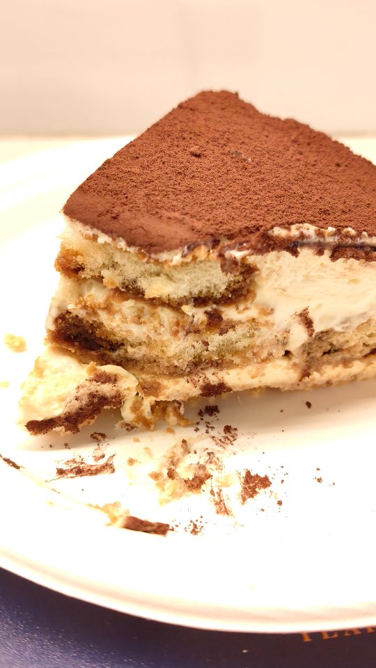 Tiramisu Cheesecake. This one looks and feels a lot like love. If you can't choose between cheesecake and Tiramisu you shouldn't have to. 

You will need
About 30 ladyfinger biscuits 
1 1/2 cups hot water mixed with 2 tbsp instant coffee powder 

For the biscuit crumb layer mix
300 gms digestive biscuits powdered 
100 gms butter melted 

For the cheesecake layer mix 
400 gms cream cheese 
1/2 cup sugar
1/2 tsp vanilla extract 
2 cups whipped cream 

For the Tiramisu layer mix
200 gms mascarpone cheese 
1/4 cup sugar 
1 cup whipped cream 

1 1/2 tbsp cocoa powder to dust the top 

* In a springform pan, first spread the biscuit layer evenly with the back of a spoon
* Then spread half the cream cheese mixture
* Take half the biscuits, dip each in coffee briefly and place in a layer over the cream cheese mixture. Don't soak for too long, the biscuit will crumble and the coffee will leak in the pan
*Spread the mascarpone mixture over the biscuits followed by another layer of biscuits dipped in coffee and then the remaining cream cheese mixture
* Leave to set in the fridge for atleast 4 hours or overnight is best
* When set, release the springform pan, dust the top of the cheesecake with cocoa powder and serve
