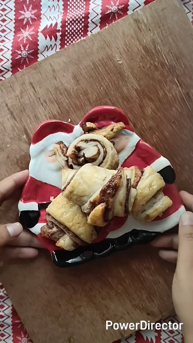 Christmas is coming !! And we need em quick and easy recipes. It can't get simpler than this. 

Here's all you'll need
200 gms store bought puff pastry
2/3 cup Nutella 
1 egg beaten 

*Let the puff pastry thaw and come to room temperature. Unroll and cut into two equal halves
* Spread the Nutella in a generous layer but don't go overboard, it'll spill out when you roll the dough
* Place the other half of the puff pastry on the top and cut into triangles
* Roll each of the pieces, starting with the wide end and place on a baking tray lined with butter paper 
*Brush lightly with the beaten egg. Leave in the fridge for 30 mins for the Nutella to firm up
* Preheat the oven to 200 C
* Put the rolls to bake in a preheated oven at 200 C for about 25-30 minutes or until the rolls turn golden brown

#christmas2025 #christmasrecipes #easycroissants #cheatcroissants #nutella #nutellarecipes #nutellarolls #easybakes #christmastreats #quickrecipes #bakingreels #bakingwithrona #ediblegifts #foodreels